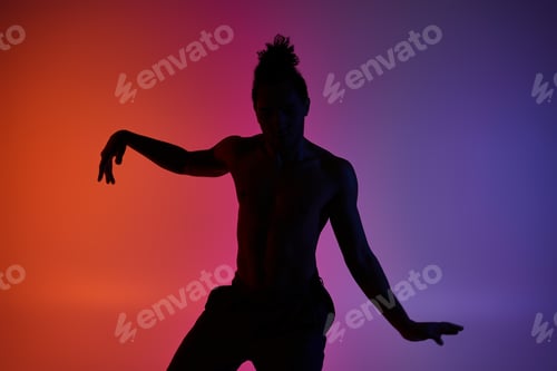Preview: Silhouette of a dancer in neon light
