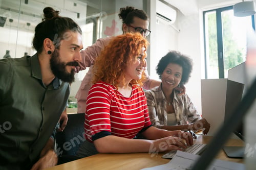 Preview: Group of business people and software developers working as a team in office