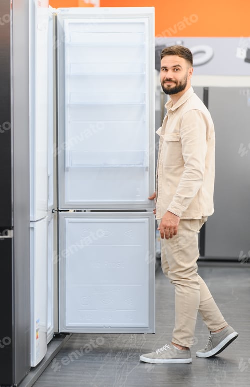Preview: Customer choosing new refrigerator in electronics store