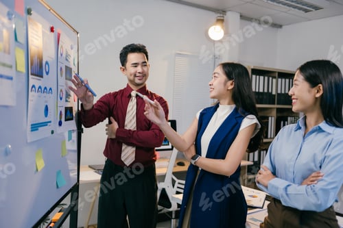 Preview: Business team collaborating and discussing marketing strategy analyzing charts and reports on whiteb