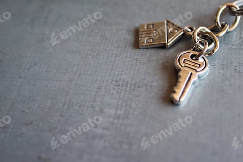 Preview: Selective focus image of house key on concrete floor
