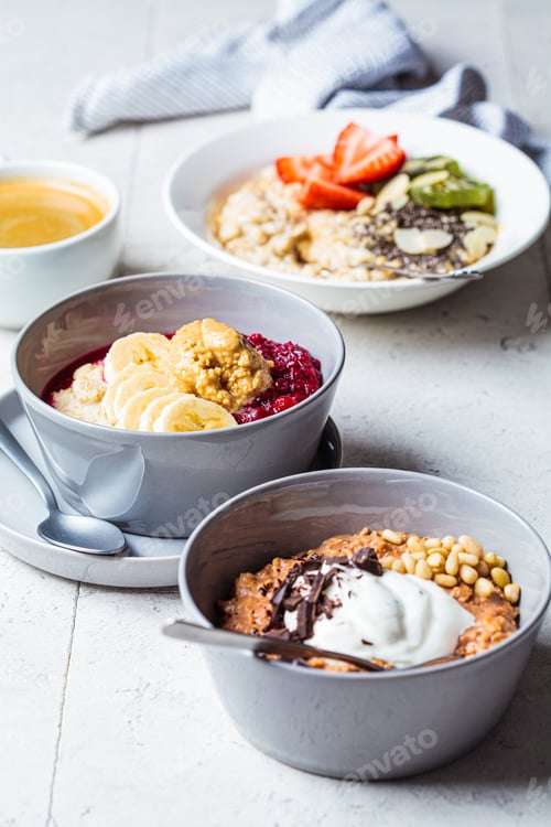 Preview: Assorted oatmeal bowls with chocolate, fruit, berry, yogurt and coffee