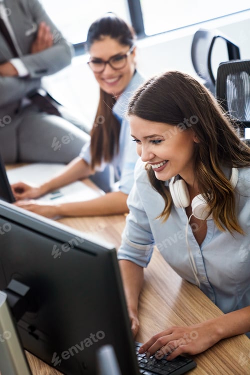 Preview: Happy business people having fun and chatting at workplace office