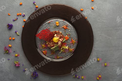 Preview: Modern restaurant dish. Veal tartare with quail egg closeup