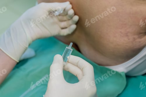 Preview: Injection with syringe in medical setting