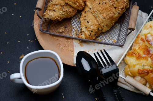 Preview: Sesame seed croissants with a cup of black coffee