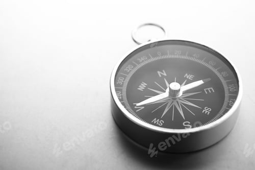 Preview: Compass on a gray gradient background, place for text