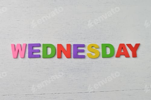 Preview: Colorful alphabet with text WEDNESDAY. A happy wednesday concept