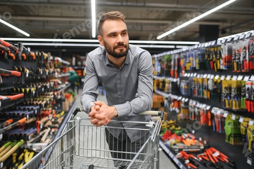 Preview: male builder in a hardware store