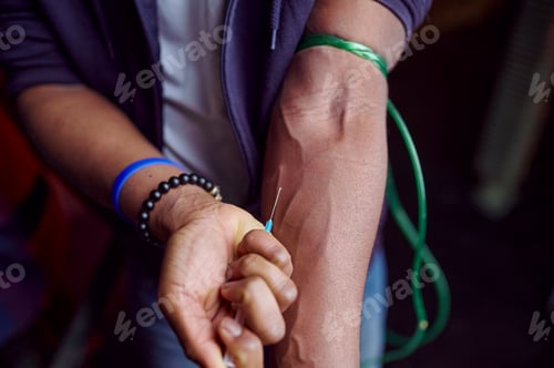 Preview: Drug addict man with syringe takes a dose