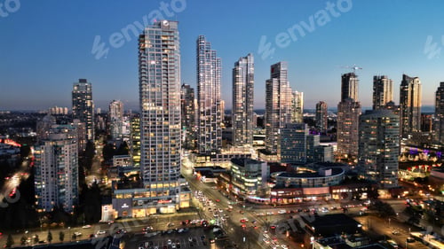Preview: a city with many buildings lit up at night in the foreground