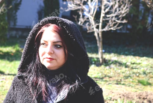 Preview: A red haired woman in the sun