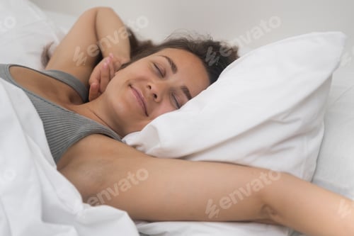 Preview: Morning Euphoria: A woman greets the day with open arms, beaming after a restful night's sleep