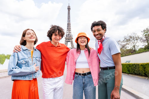 Preview: Group of young happy friends visiting Paris and Eiffel Tower