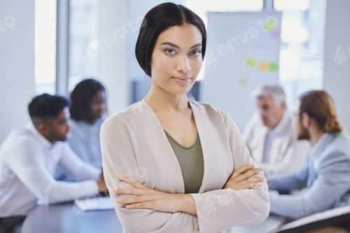 Preview: Shot of a beautiful young businesswoman standing in the boardroom