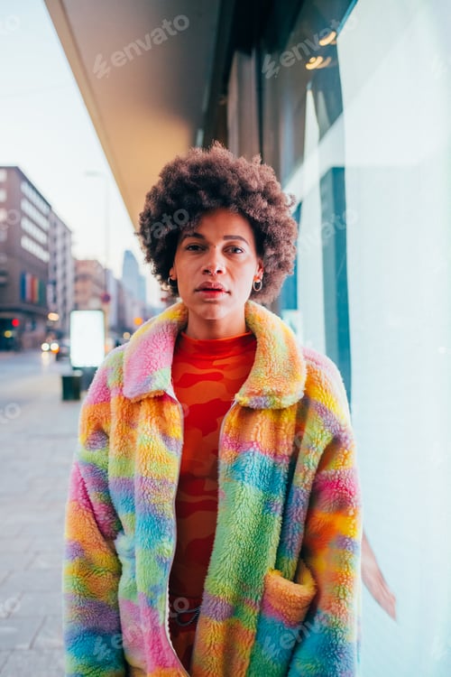 Preview: Young black stylish contemporary black woman outdoors at night posing