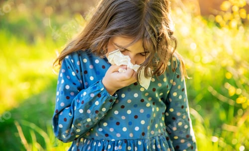 Preview: Child girl allergic to flowers. Selective focus.