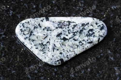 Preview: sample of polished foyaite mineral on black