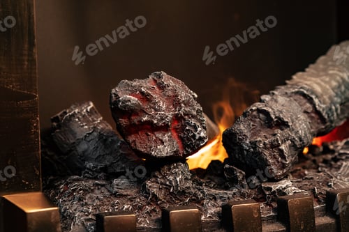 Preview: Wood logs burning in fireplace close up