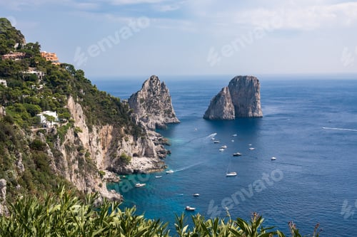 Preview: View of cliff coast of Capri Island with famous faraglioni rocks