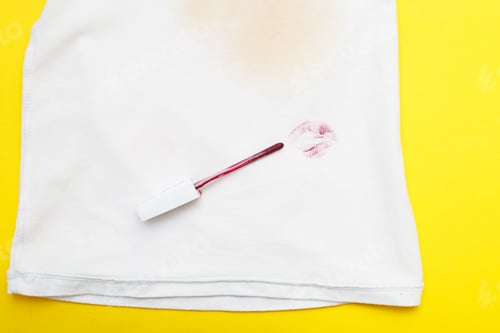 Preview: red lipstick on a white clothes with dirty stain from kiss