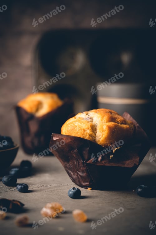 Preview: Sweet homemade pastries muffin with blueberries and fresh berries on stone background.