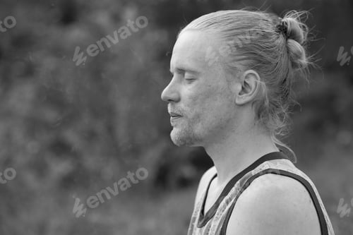 Preview: Portrait of a male hipster in profile. Black and white