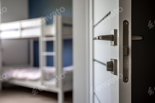 Preview: Close-up of metal doorknob on blurred background of home interior.