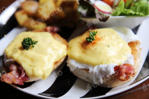 Preview: Egg Benedict With Bacon And Potato On Wood Background