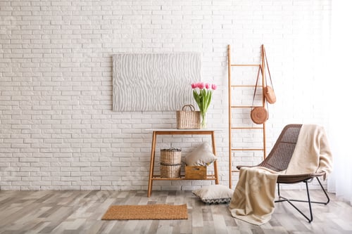 Preview: Stylish living room interior with cozy armchair near brick wall. Space for text