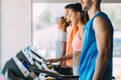 Preview: Group of friends exercising on treadmill machine