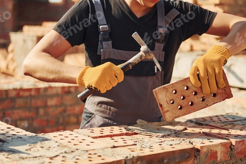 Preview: Construction worker in uniform and safety equipment have job on building