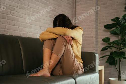 Preview: Depressed woman crying at home