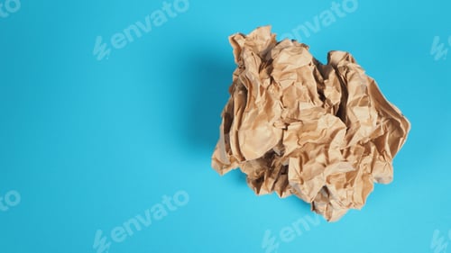 Preview: Crumpled brown paper.It is mauled on blue background.