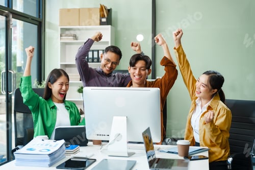 Preview: In a boardroom, an Asian team discusses startup financials and business terms.