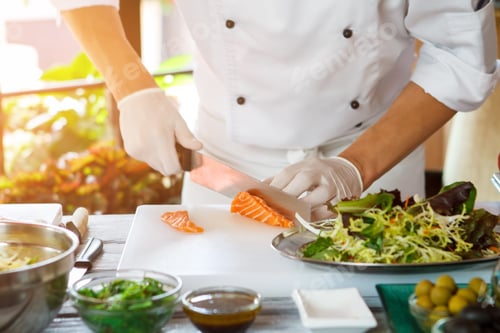 Preview: Hands with knife cut fish