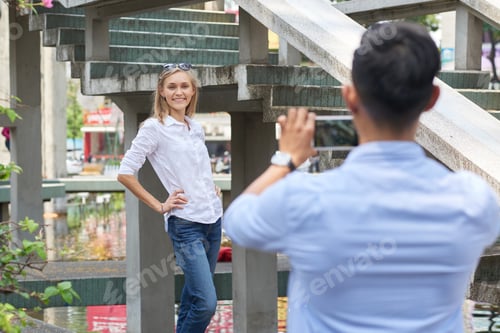 Preview: Woman Posing for Photo in Front of Boyfriend