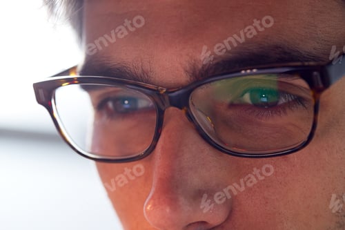Preview: Close Up Of Businessman Wearing Glasses Looking At Computer Screen