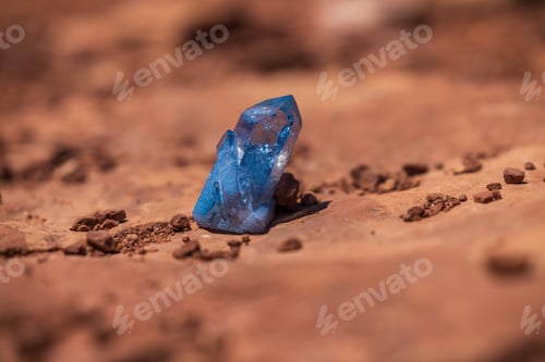 Preview: Blue crystal simmering in sunlight with sandstone background