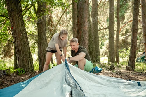 Preview: Father And Daughter Setting Up A Tent