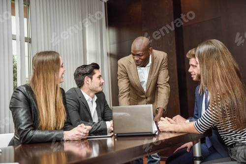 Preview: Group of multiethnic busy people working in an office
