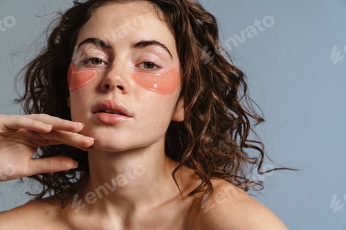 Preview: Beautiful shirtless girl with eyes patches posing at camera