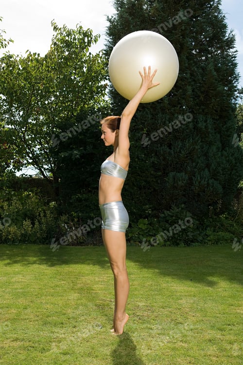 Preview: Woman holding exercise ball