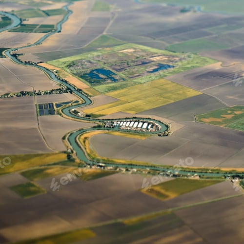 Preview: Aerial View of a River Passing Through Farmland