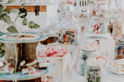 Preview: Arranged candies and sweets on a candy bar during a party, soft colors and added film grain