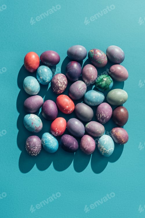 Preview: food composition with easter eggs in square shape, on blue