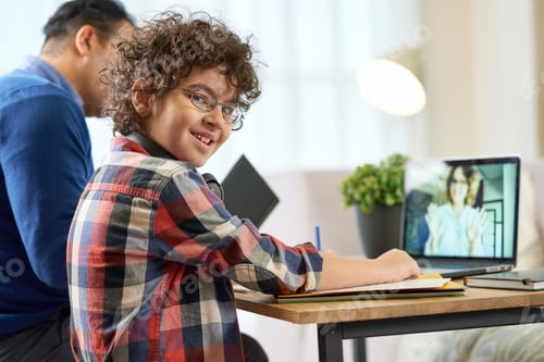 Preview: Boy Learning Online with Adult Supervising in Home