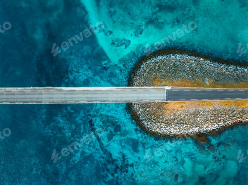 Preview: Aerial view of bridge, sea with waves and stones at sunset