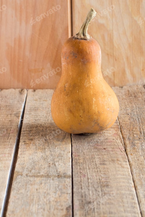Preview: Pumpkin On Wooden Background