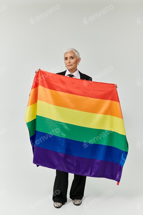 Preview: Confident Woman of Color Celebrates Pride With Rainbow Flag in Elegant Attire